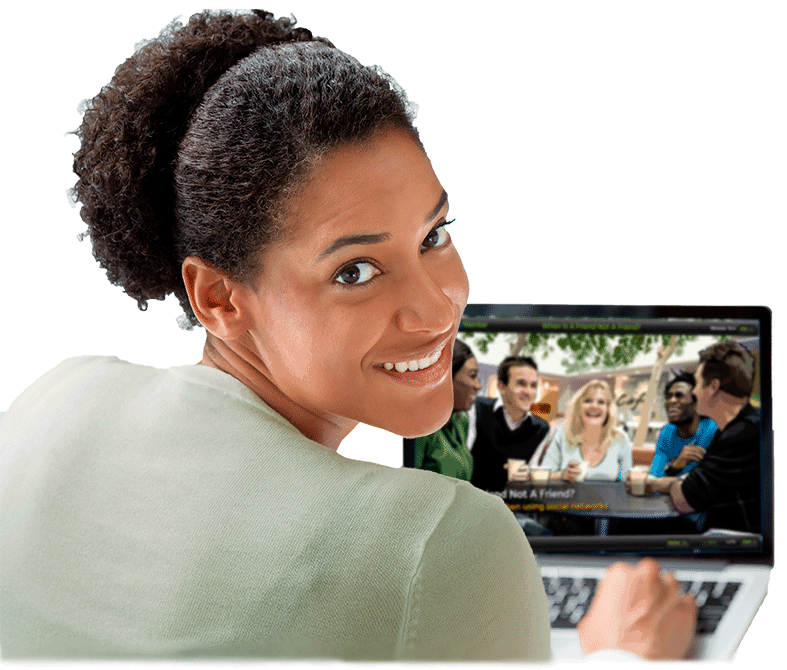 Security Mentor Lesson On Laptop Woman taking Security Mentor security awareness training lesson on laptop